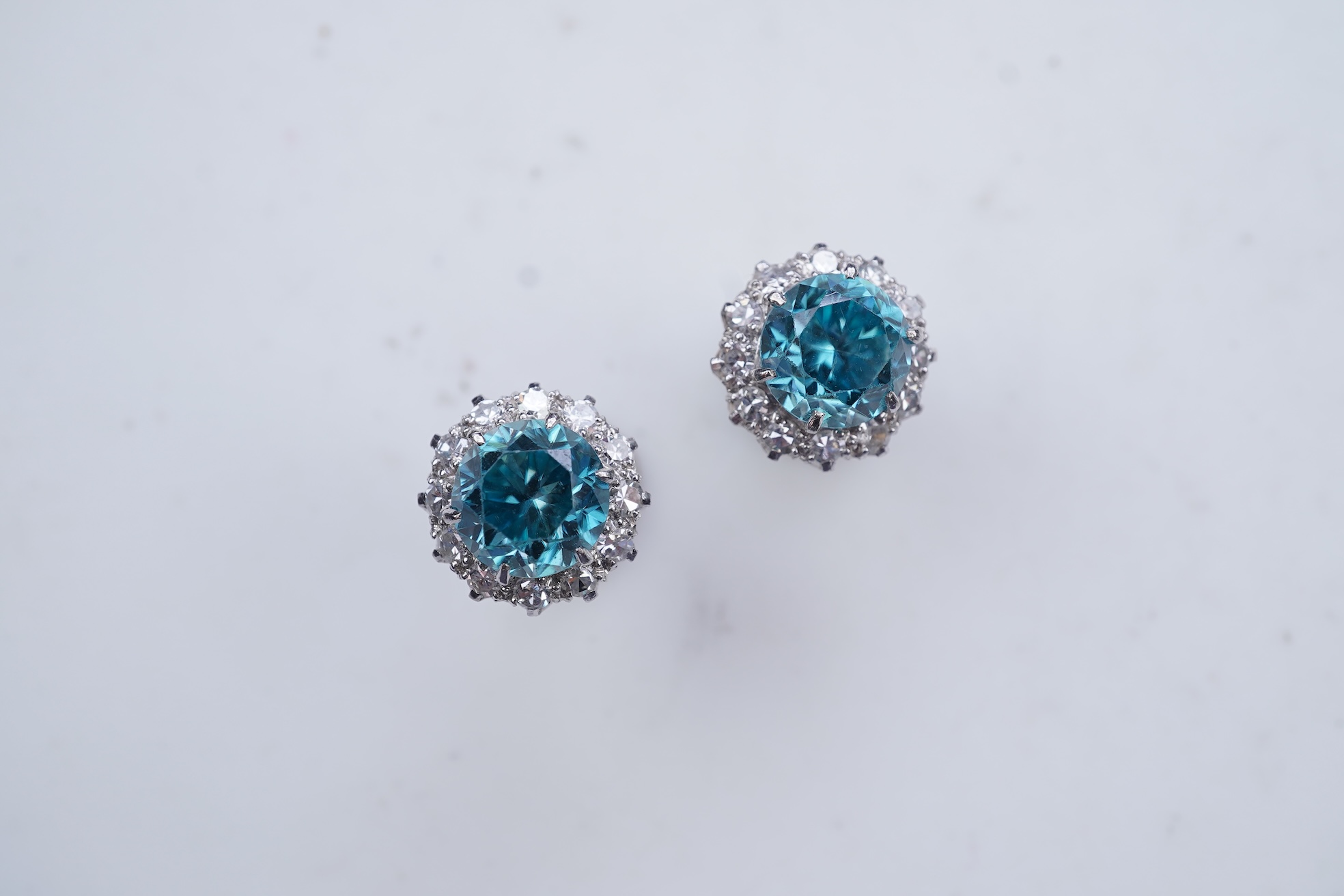 A pair of zircon and diamond earrings, mid 20th century